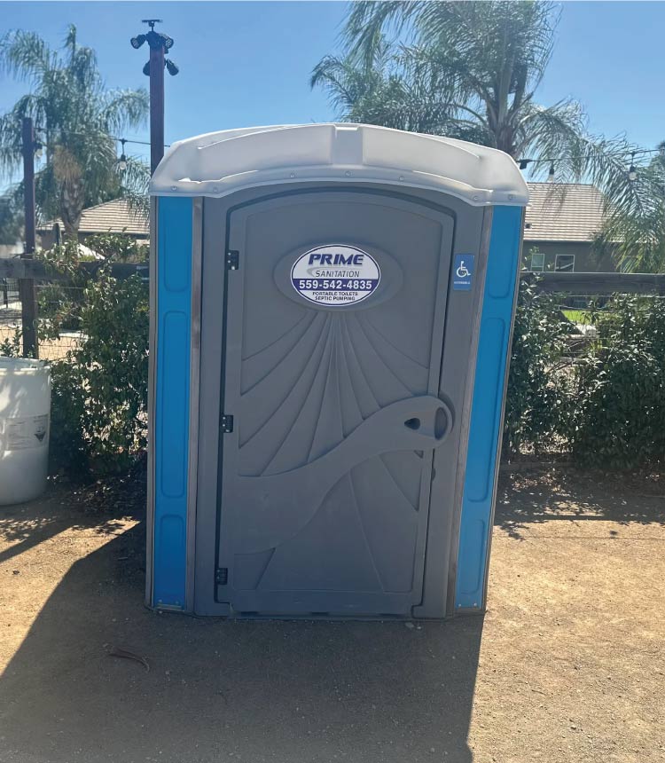 Standard portable toilet on a field, providing a convenient porta potty rental in Dinuba.</p>
<p>