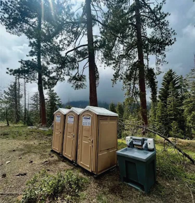 ADA-accessible portable toilet with spacious interior for individuals with disabilities.